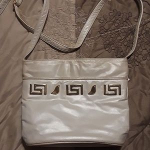 White leather purse gold accents